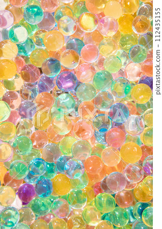 Background of bright multi color transparent gel balls on a sunny day and concept of multitude. Background of bright multi color transparent gel balls on a sunny day and concept of multitude. 112435155