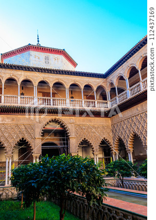 Patio de las Doncellas in Royal palace, Real Alcazar (built in 1360) in Seville, Andalusia, Spain. Real Alcazar is iconic and famous Moorish royal palace 112437169