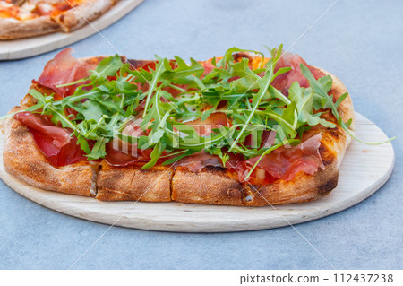 Tasty pinsa on a table Tasty pinsa on a table 112437238