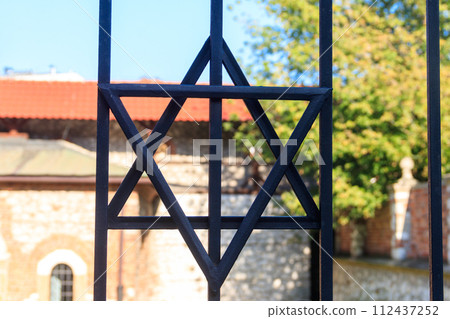 Jewish star of David on the metal fence Jewish star of David on the metal fence 112437252