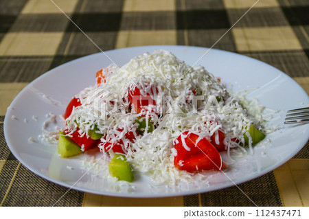 Traditional Bulgarian Shopska salad on a table 112437471