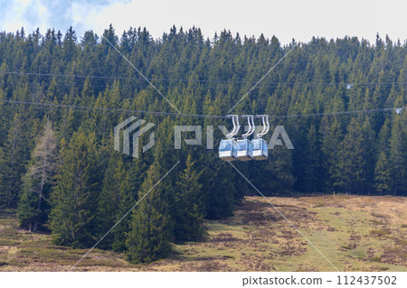 Cable cars to the peak of Niederhorn mountain in Switzerland 112437502