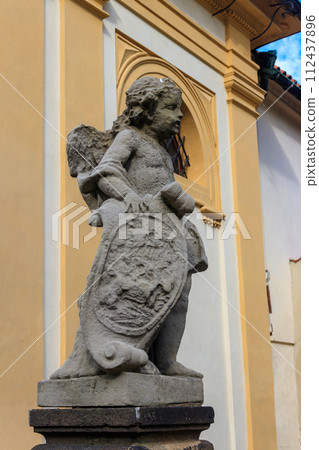 Baroque statue before facade Loreta Monastery in Prague, Czech Republic 112437896