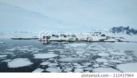 Antarctica polar science station, people explore ice movement, weather, and environmental conditions of global climate change. Scientific research wildlife, expedition to South Pole. Aerial drone shot Antarctica polar science station, people explore ice movement, weather, and environmental conditions of global climate change. Scientific research wildlife, expedition to South Pole. Aerial drone shot 112437964