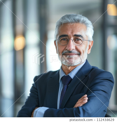 Portrait of an Arab male businessman 50-60 years in a suit against the background of an office 112438629