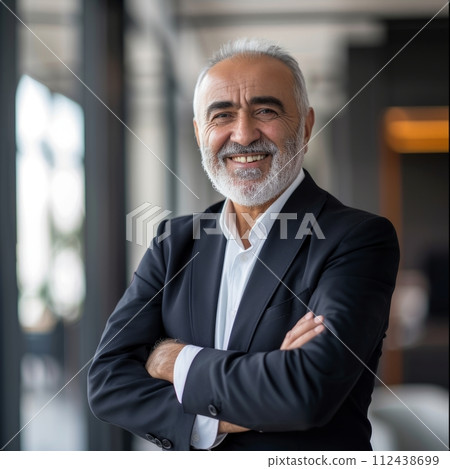 Portrait of an Arab male businessman 50-60 years in a suit against the background of an office 112438699