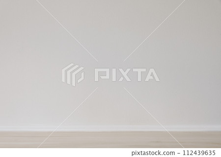 Modern interior mockup. Simple background with empty beige wooden floor and blank white wall. Scandinavian home. Space, room for product display. House, apartment. Indoor architecture concept. Modern interior mockup. Simple background with empty beige wooden floor and blank white wall. Scandinavian home. Space, room for product display. House, apartment. Indoor architecture concept. 112439635