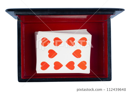 vintage old black and red casket with vintage playing cards 112439648