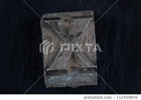 Antique vintage movable type alphabet letter X. 112439656