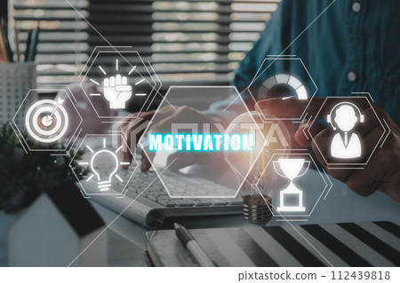 Motivation concept, Businessman hand touching lightbulb on desk with motivation icon on virtual screen. Motivation concept, Businessman hand touching lightbulb on desk with motivation icon on virtual screen. 112439818