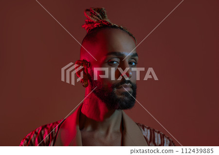 Black man in neon studio light 112439885