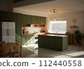 a sun-filled green kitchen 112440558