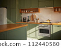 a sun-filled green kitchen 112440560