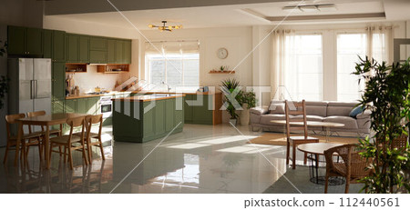 a sun-filled green kitchen 112440561