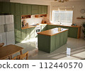 a sun-filled green kitchen 112440570