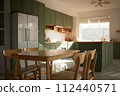 a sun-filled green kitchen 112440571