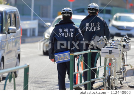 Image of police officer cracking down on traffic violations 112440903