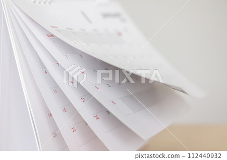Calendar page flipping sheet on wood table background business schedule planning appointment meeting concept Calendar page flipping sheet on wood table background business schedule planning appointment meeting concept 112440932