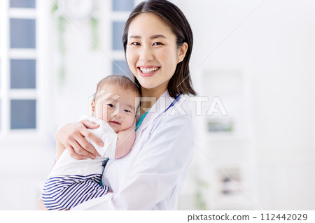 Pediatrics female doctor baby 112442029