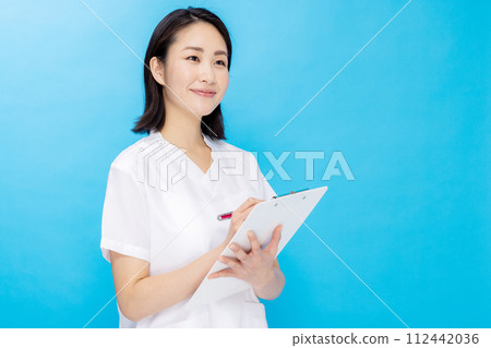 Young woman in a nurse color back 112442036