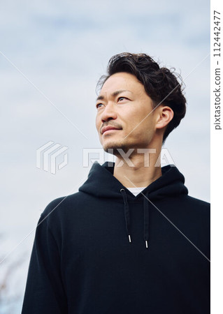 A man looking up at the sky A man looking up at the sky 112442477