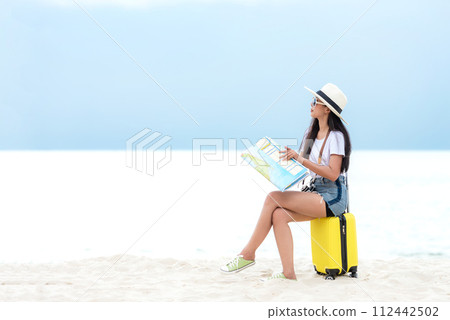 Happy traveler and tourism young women travel summer on the beach. 112442502