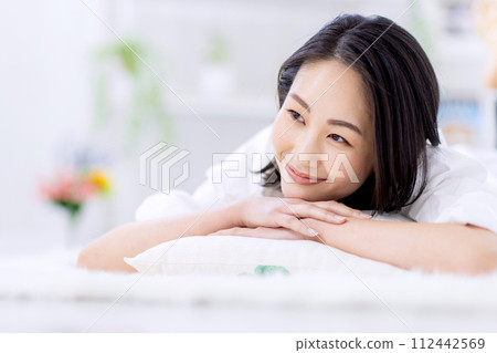 Portrait of a woman relaxing at home 112442569