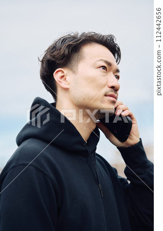 A man who makes a phone call A man who makes a phone call 112442656