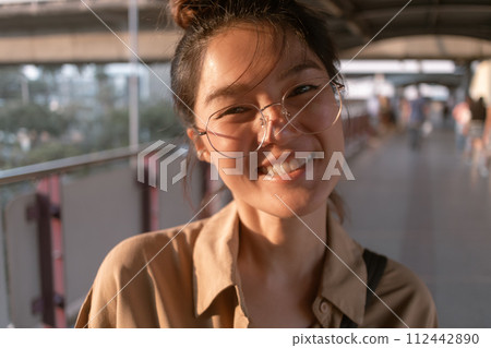 Woman making funny hilarious face to camera. 112442890