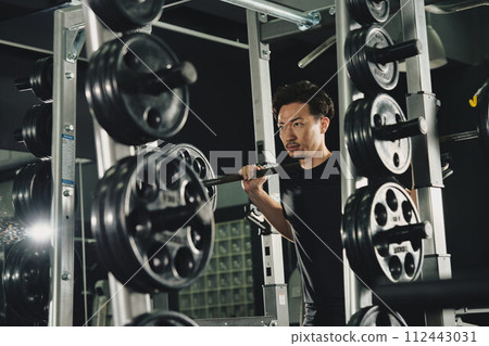 A man doing machine training at the gym A man doing machine training at the gym 112443031
