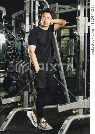 Portrait of a man wearing training clothes Portrait of a man wearing training clothes 112444283