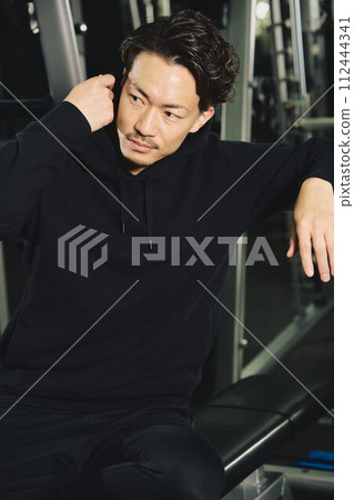 Portrait of a man wearing training clothes Portrait of a man wearing training clothes 112444341