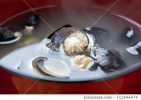 A close-up of miso soup with clams. A close-up of miso soup with clams. 112444474