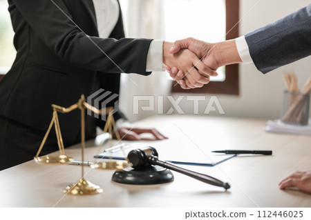 Asian lawyer man working on table office Writing a document, law and justice concept. Asian lawyer man working on table office Writing a document, law and justice concept. 112446025