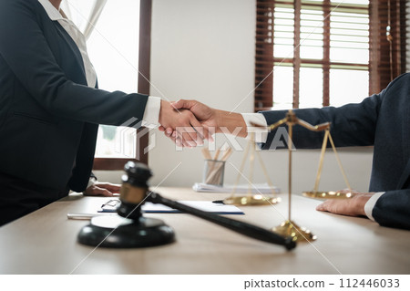 Asian lawyer man working on table office Writing a document, law and justice concept. 112446033