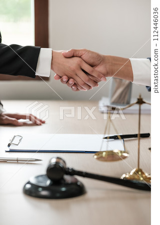 Asian lawyer man working on table office Writing a document, law and justice concept. 112446036