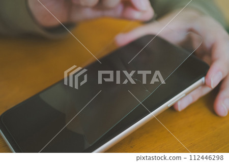 Smartphone glass film breaks Smartphone glass film breaks 112446298