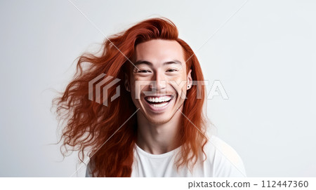 Handsome young male guy smile Asian with long red hair, on white background, banner, copy space, portrait. 112447360