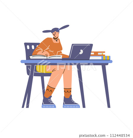 Student at a study session with a laptop and books on a desk 112448534