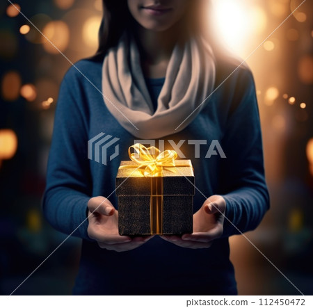 Elegant woman holding a wrapped gift, congratulations, gold . The scene is adorned with a touch of gold, adding a luxurious and celebratory ambiance to the moment. Elegant woman holding a wrapped gift, congratulations, gold . The scene is adorned with a touch of gold, adding a luxurious and celebratory ambiance to the moment. 112450472