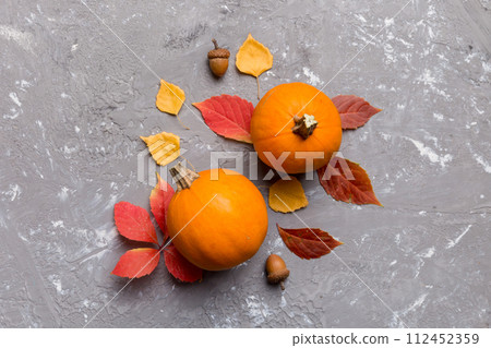 Autumn composition. Pattern made of dried leaves and other design accessories on table. Flat lay, top view 112452359
