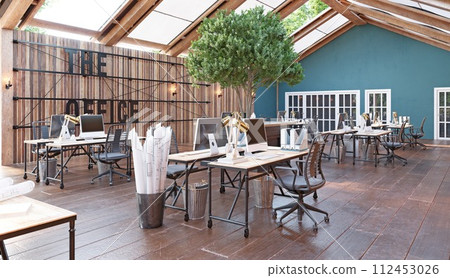 A large open office space with wooden floors A large open office space with wooden floors 112453026