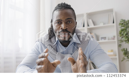 African American businessman having video conference, talking on web camera 112453374