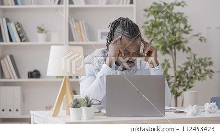 Upset African American businessman trying to find a solution to problem, difficult task 112453423