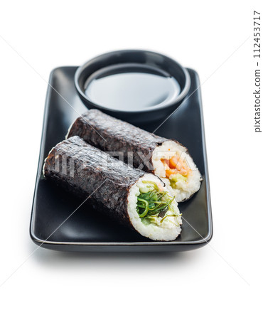 Sushi Roll on Black Plate With bowl of soy sauce. 112453717