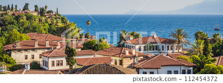 Old town Kaleici in Antalya. Panoramic view of Antalya Old Town port, Taurus mountains and Mediterrranean Sea, Turkey BANNER, LONG FORMAT Old town Kaleici in Antalya. Panoramic view of Antalya Old Town port, Taurus mountains and Mediterrranean Sea, Turkey BANNER, LONG FORMAT 112454372