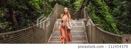 Woman tourist in Rope bridge in Yildiz Park. Besiktas, Istanbul, Turkey. Turkiye BANNER, LONG FORMAT 112454379