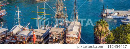 Old town Kaleici in Antalya. Panoramic view of Antalya Old Town port, Taurus mountains and Mediterrranean Sea, Turkey BANNER, LONG FORMAT Old town Kaleici in Antalya. Panoramic view of Antalya Old Town port, Taurus mountains and Mediterrranean Sea, Turkey BANNER, LONG FORMAT 112454417