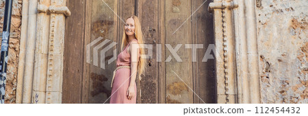 Woman tourist in Old town Kaleici in Antalya. Turkiye. Panoramic view of Antalya Old Town port, Taurus mountains and Mediterrranean Sea, Turkey BANNER, LONG FORMAT Woman tourist in Old town Kaleici in Antalya. Turkiye. Panoramic view of Antalya Old Town port, Taurus mountains and Mediterrranean Sea, Turkey BANNER, LONG FORMAT 112454432