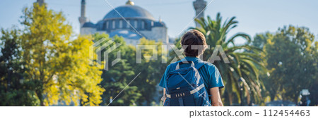 Man tourist enjoying the view Blue Mosque, Sultanahmet Camii, Istanbul, Turkey BANNER, LONG FORMAT 112454463